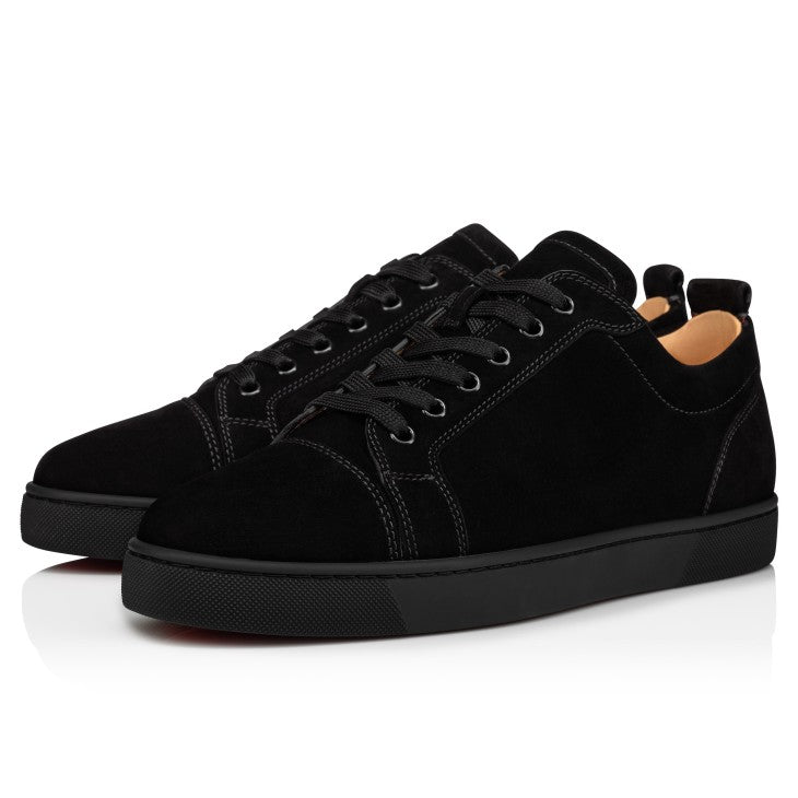 Christian Louboutin Junior ATHENA ™ shoe with signature red sole and elegant black leather upper, styled for a fashionable look.