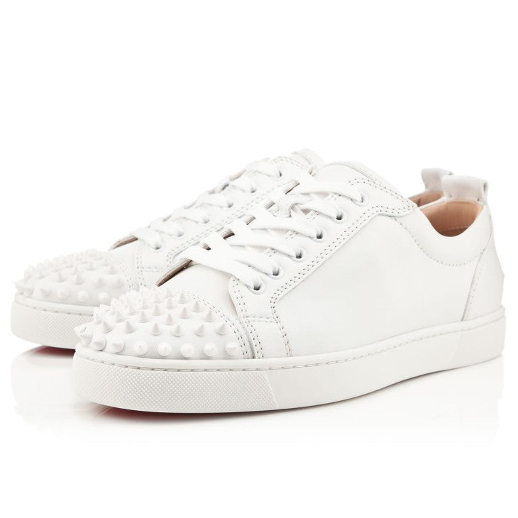 Christian Louboutin Junior shoes by ATHENA ™, featuring signature red soles and stylish design, displayed on a neutral background.
