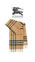 ATHENA™ Burberry scarf featuring classic check pattern, soft fabric, and fringed edges, styled for elegant winter wear.