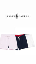Athena™ Ralph Lauren swimming shorts with blue and white pattern, elastic waistband, and side pockets for beach or pool use.